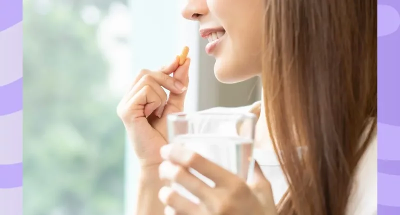 woman taking a supplement