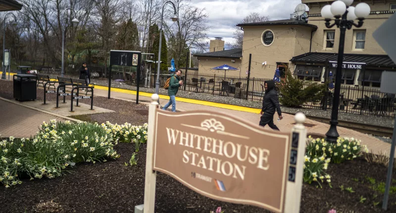 People are seen walking around the train station on April 5, 2024, in Whitehouse Station, New Jersey, the epicenter of a 4.8 magnitude late-morning earthquake