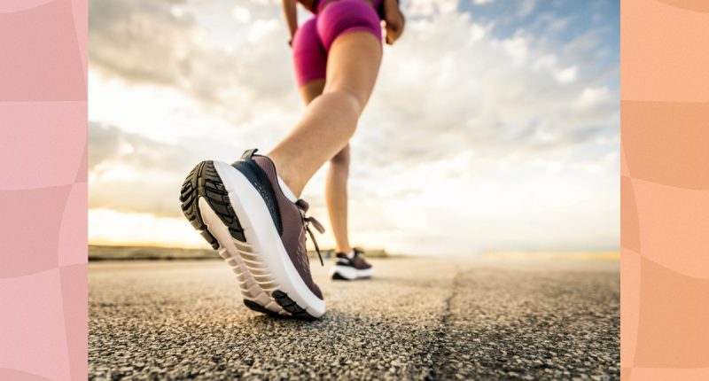 close-up of woman power walking on road on sunny day