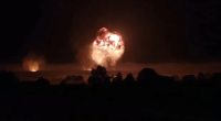 Incredible footage shows the ammo depot exploding in a mushroom fireball