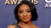Fans accuse Simone Biles of 'dirty' and 'disrespectful' reaction to country music legend's wife during CMAs