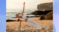fit woman doing side plank exercise on the beach