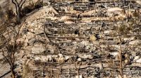 24 dead as fire crews try to corral Los Angeles blazes before winds return this week