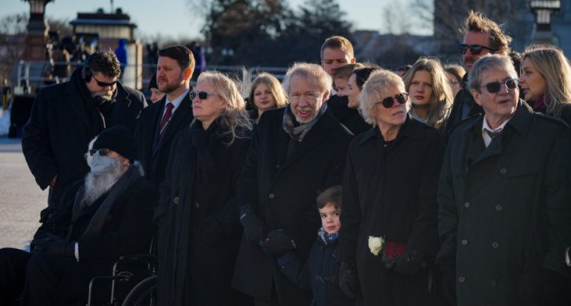 Wearing sunglasses, Amy Carter, second left, was in attendance at her father's funeral