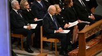 Joe Biden was seen looking tired as he sat next to Jill Biden at Jimmy Carter's state funeral service
