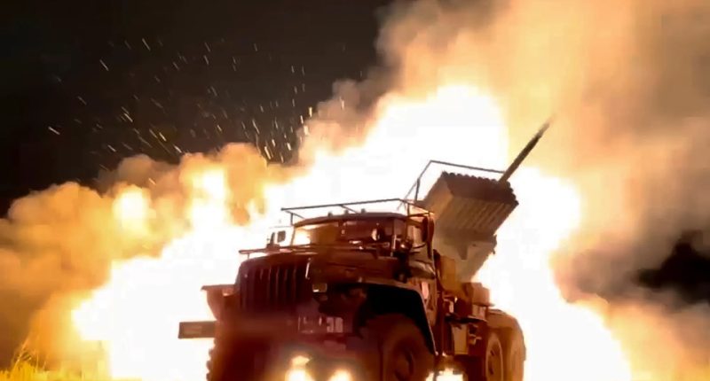 A Russian rocket launcher fires toward Ukrainian position