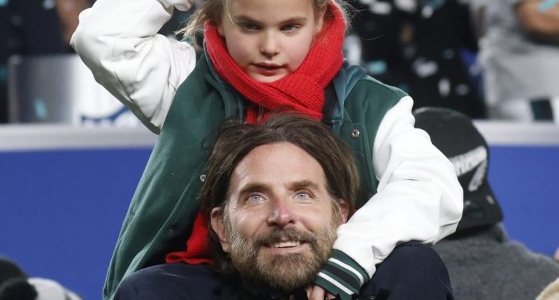 Bradley Cooper hoists daughter Lea on his shoulders at Philadelphia Eagles game and more star snaps