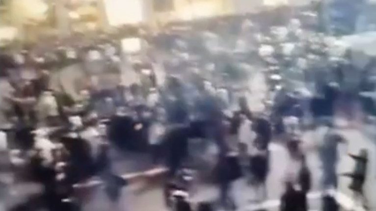 Video of a large crowd celebrating New Year's Eve in Milan.
