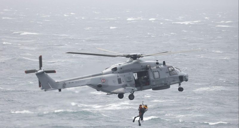 French helicopter performing a sea rescue.