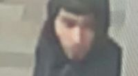 Low-quality CCTV image of a hooded suspect.