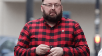Man in red and black plaid shirt.