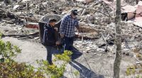 Emotional Mel Gibson surveys smoldering remains of his Malibu house