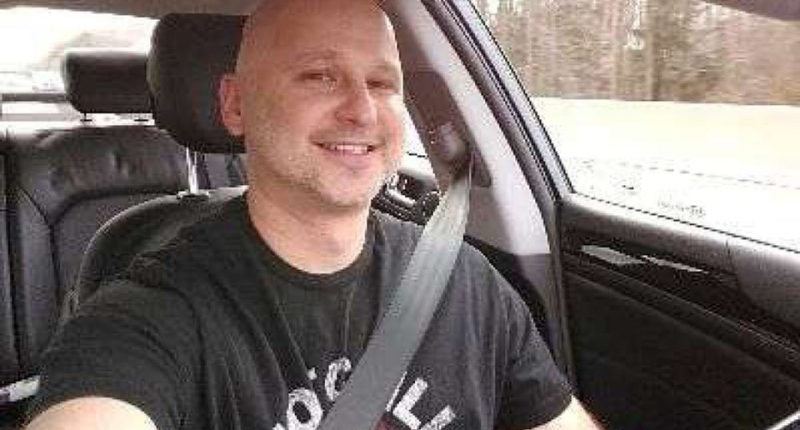 Photo of Rahamim Shy in a car.