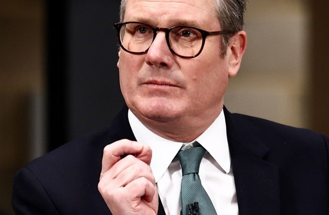 Prime Minister Keir Starmer speaking at a podium, unveiling a plan for change.