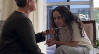 A woman being interviewed on a phone.