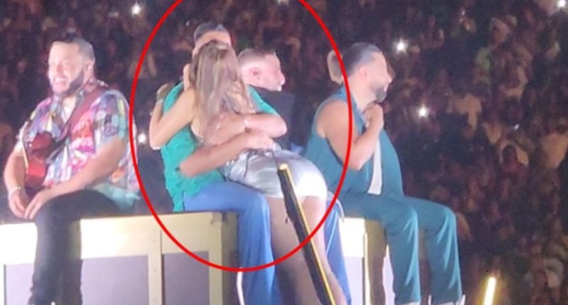Miriam Cruz was caught snogging singer Romeo Santos on stage in the Dominican Republic