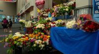 Flowers left at an ice rink in memory of those killed in a helicopter and plane collision.