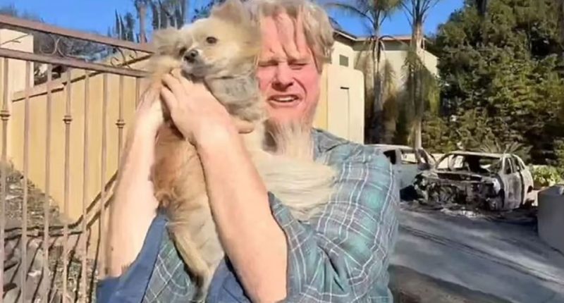 Man joyfully reunited with his dog after a fire.