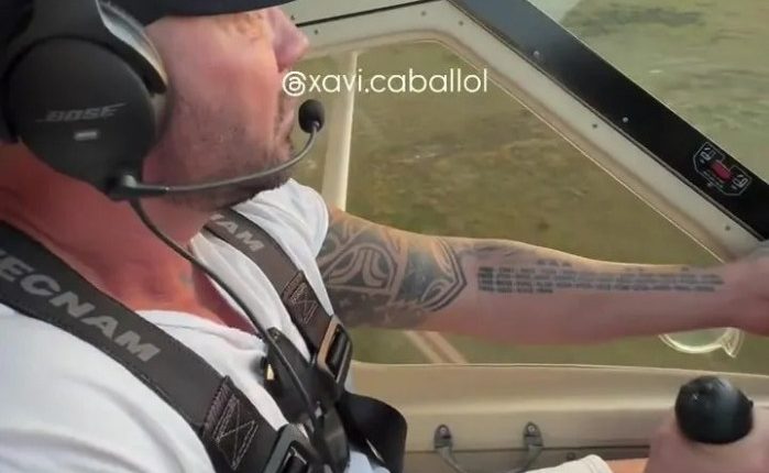 Man piloting an ultralight aircraft.