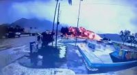 Large fire and explosion near a road and skate park.
