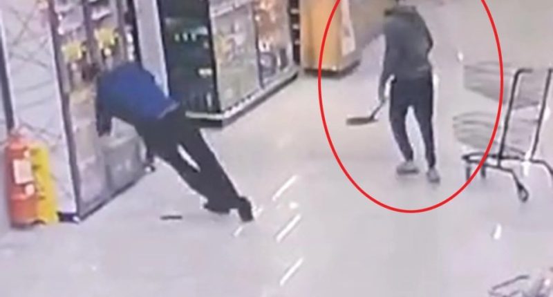 CCTV footage of a man hitting another man in the head with a shovel in a supermarket.