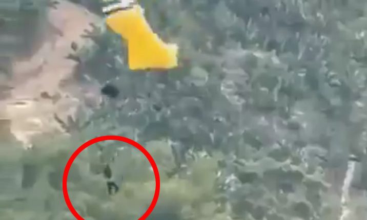 Video still of a skydiver falling to the ground.