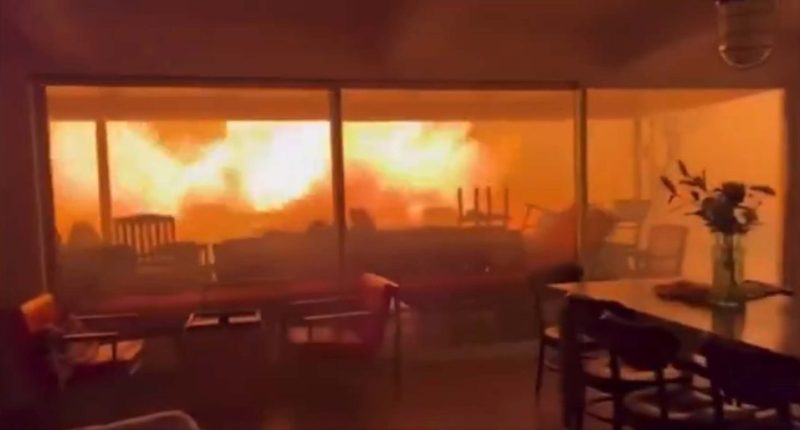 Huge flames can be seen outside the lounge window
