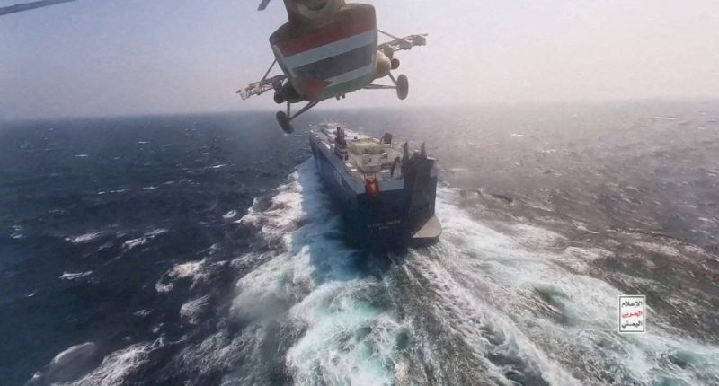 a helicopter is flying over a large ship in the ocean