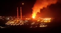 Fire at a power plant at night.