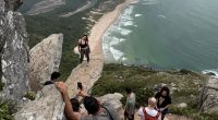 Influencers and tourists are seen at Pedra do Surfista (Surfer's Rock) near Florianopolis, Brazil