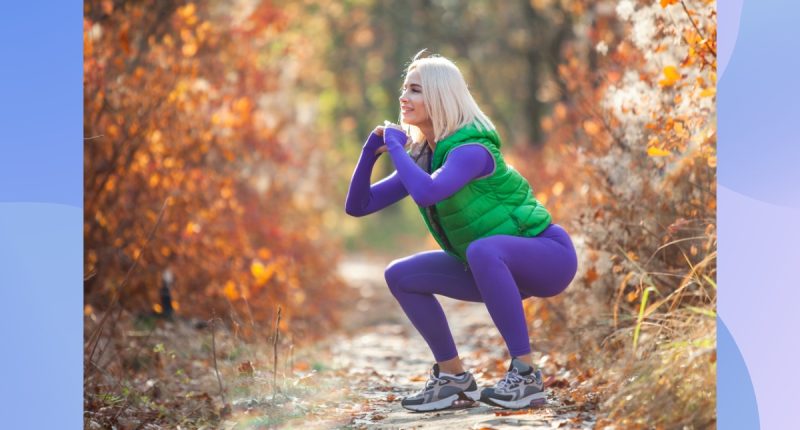 fit blonde woman doing squats outdoors