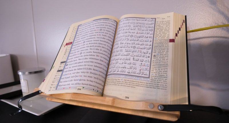 A Quran was found opened on the desk