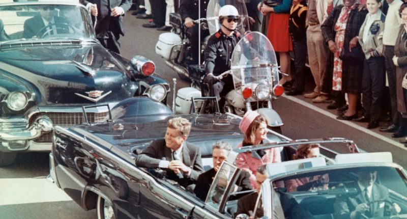 President John F. Kennedy, Jacqueline Kennedy, Texas Governor John Connally, and others in a motorcade.