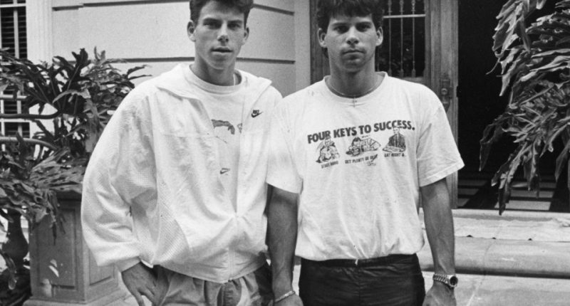Black and white photo of Erik and Lyle Menendez in front of their Beverly Hills home.