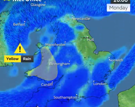 UK weather map showing yellow rain warning in Wales.