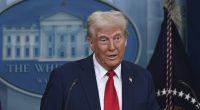 President Donald Trump speaking at a press briefing.