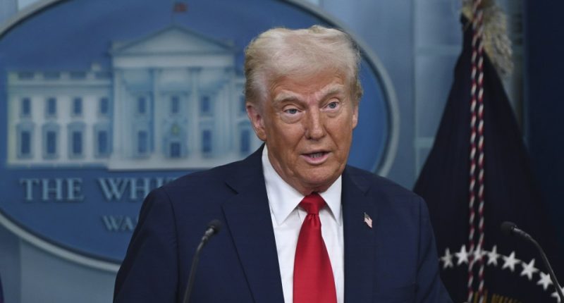 President Donald Trump speaking at a press briefing.