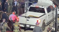 Police surround the white pick up truck used to run over dozens of people in New Orleans