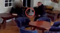 Security camera footage of a physical altercation in a restaurant.