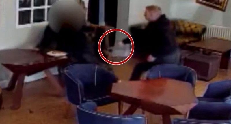 Security camera footage of a physical altercation in a restaurant.
