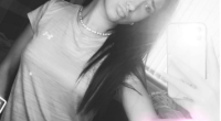Black and white selfie of a teenage girl.