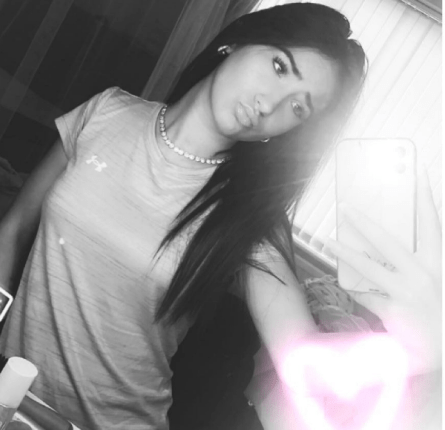 Black and white selfie of a teenage girl.