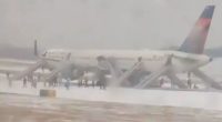 Passengers evacuate Delta Air Lines plane via emergency slides