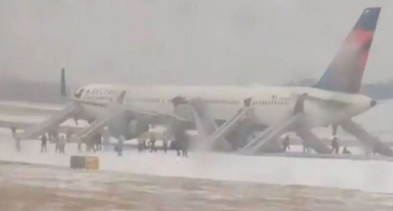 Passengers evacuate Delta Air Lines plane via emergency slides