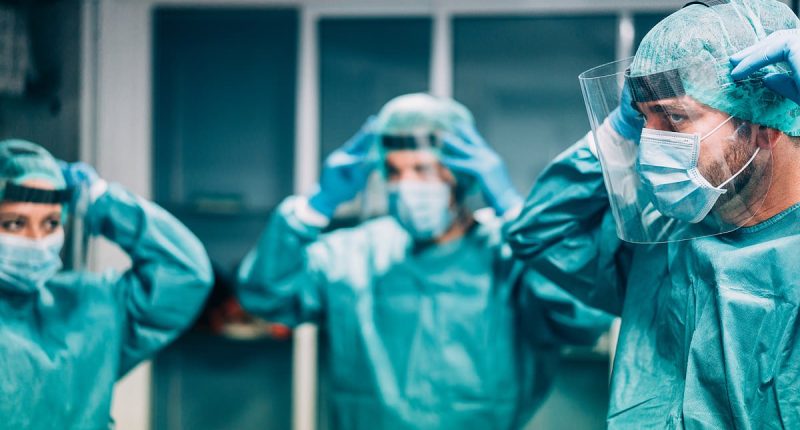 More US hospitals bring back mask mandates amid fears of quad-demic