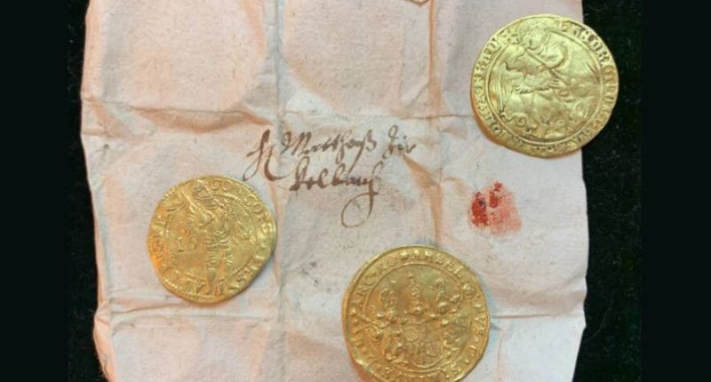 400-year-old gold coins found hidden in a statue.
