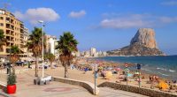 High-angle view of Benidorm's dense cityscape, hotels, and beach.