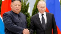 Kim Jong-un and Vladimir Putin shaking hands.