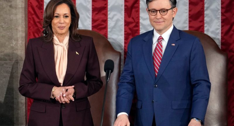 Vice President Kamala Harris stands with House Speaker Mike Johnson as a joint session of Congress convenes to confirm the Electoral College vote