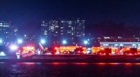 epa11862639 Rescue teams gather to respond to an airplane crash in the Potomac River near Ronald Reagan National Airport in Washington, DC, USA, 29 January 2025. According to a preliminary statement from the United States' Federal Aviation Authority (FAA), a PSA Airlines Bombardier CRJ700 regional jet that departed earlier today from Witchita, Kansas collided in midair with a Sikorsky H-60 helicopter while on approach to Reagan Washington National Airport. EPA/JIM LO SCALZO